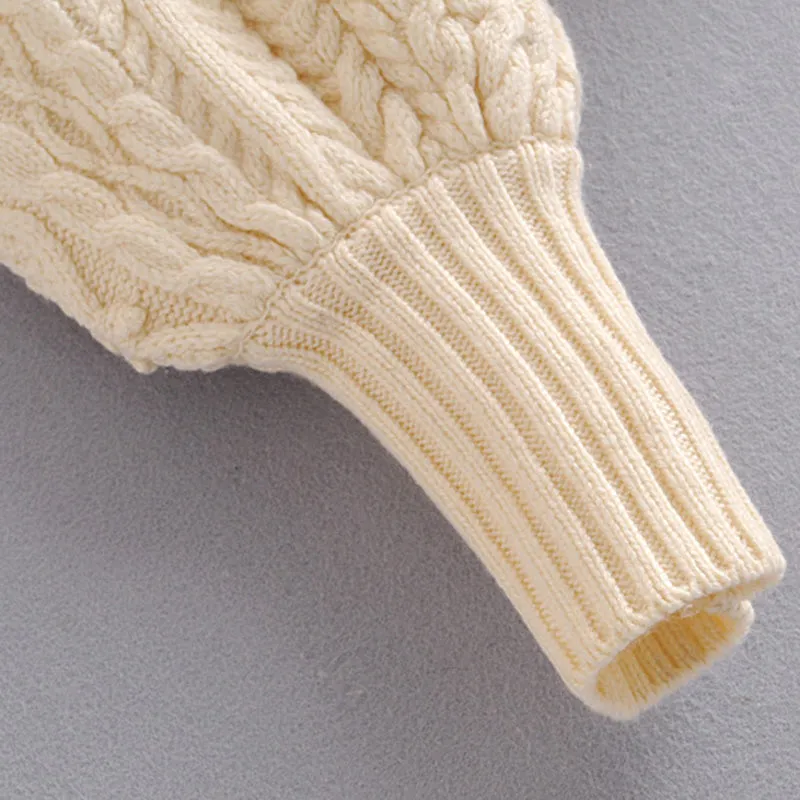 CABLE-KNIT SWEATER WITH RUFFLES
